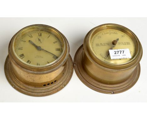 A Celest brass "Yacht Alarm" bulkhead clock and a matching barometer, each diameter 10cm.