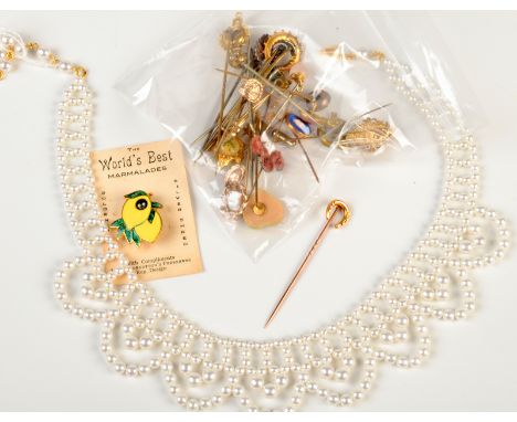 A 15ct. gold horseshoe stick pin, together with other stick pins including gold and silver etc. 