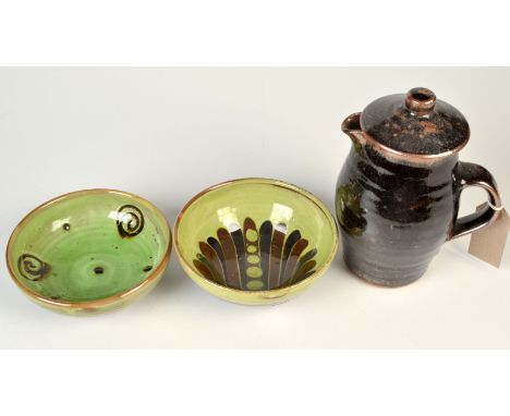 Two Sidney Tustin Winchcombe Pottery bowls and a Leach Standard Ware coffee jug and lid.
