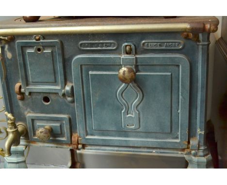 A small enamel cast iron stove by Godin, with grey/blue enamel. 72 x 54cm Condition Report: Lot 281 - knob from pine box door