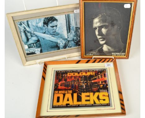 Two framed prints of Marlon Brando and a Dr Who & The Daleks transparency print.