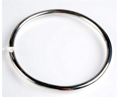 A simple heavy gauge silver bangle.