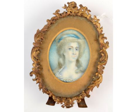A portrait miniature in 18th century style with ornate gilt brass rococo frame. Frame height 10cm.