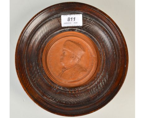 A late 18th century terracotta portrait plaque by Jean-Baptiste NINI showing Benjamin Franklin with the wording 'B. Franklin 