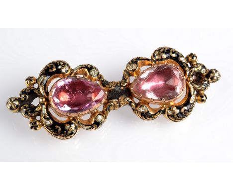 A pair of Victorian gold earrings with black and white enamel and pink foiled stones, now mounted together as a brooch. Condi