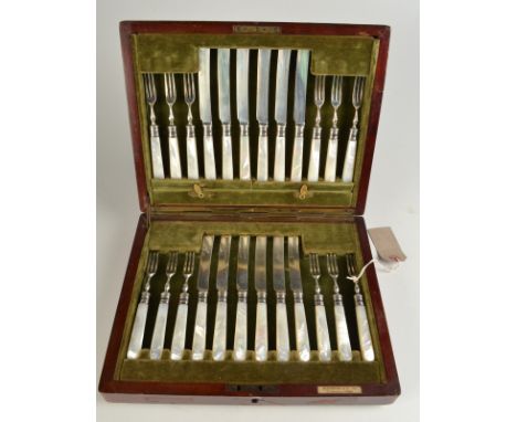 A set of 12 Elkington dessert knives and forks with silver blades and tines and mother of pearl handles in fitted case. 