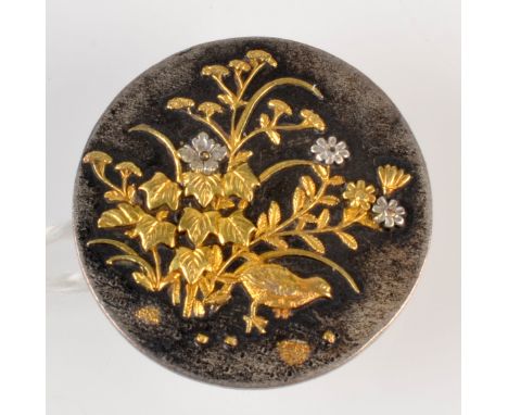 A Japanese Shakudo button with impressed seal mark, diameter 2.4cm. 