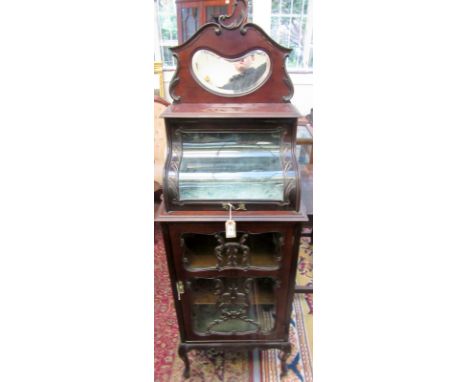 A late Victorian music cabinet the top with a display shelf under a glazed door, 174 x 56cm.