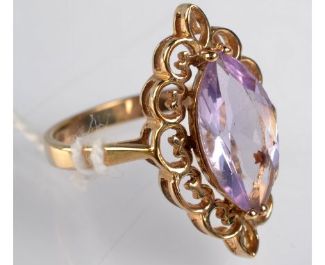 A 9ct. gold ring set a lozenge shape, faceted amethyst. Condition Report: Size O