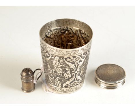 An early 20th century miniature silver flour dredger, an engine turned silver pill box and an Indian silver repoussé decorate