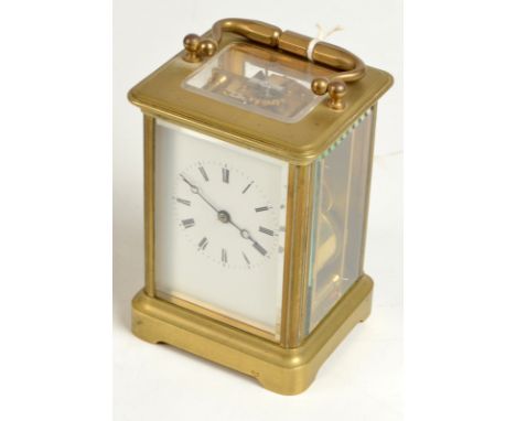 A brass chiming carriage clock, height 12.3cm. Condition Report: the main spring is good but no movement once wound, top wind