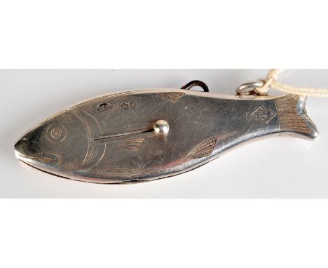 A rare gentleman's compendium by Thornhill in the form of a silver fish. It incorporates a whistle, a button hook, a knife an