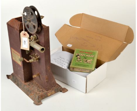 A Kodatoy Universal Model tinplate cine projector and six films including Mickey Mouse and Felix The Cat.