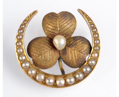 A high purity gold pearl set crescent brooch, with a central pearl set clover leaf. Condition Report: Weight 5.5g.