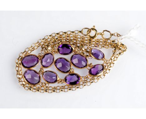 A 9ct. gold and amethyst necklace, length 48cm.