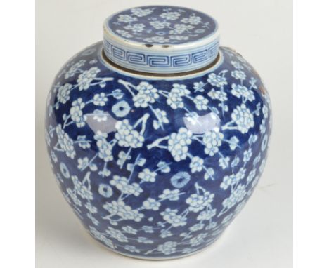 A large Chinese porcelain blue and white Kangxi six character mark ginger jar with prunis blossom design, height 23cm.