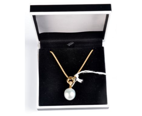 An impressive 18ct. gold and diamond necklace with a single pearl drop of 1.5cm.