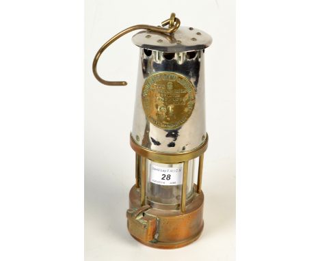 A miner's chrome and brass lamp by The Protector Lamp & Lighting Co. Ltd., height 24cm.