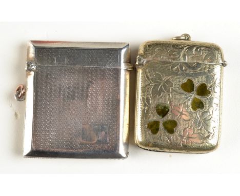 An engine turned silver vesta case, Birmingham 1925 and a plated clover leaf engraved vesta case.