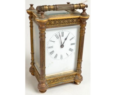 A brass carriage clock, the corners cast with classical columns between floral friezes, inscribed 'P E Tooth, 1st prize, Brig