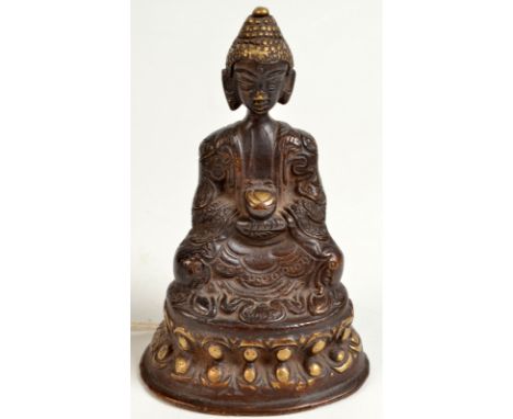 An oriental small bronze figure of a seated Buddha. 