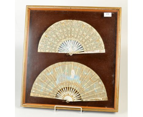 Two mounted and framed fans, one with mother of pearl sticks and floral and gold thread leaf, the other with gilt painted sti