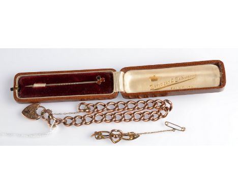 A 9ct. gold curb link bracelet with padlock clasp, together with a gold bar brooch 14.1g, and a stick pin case.