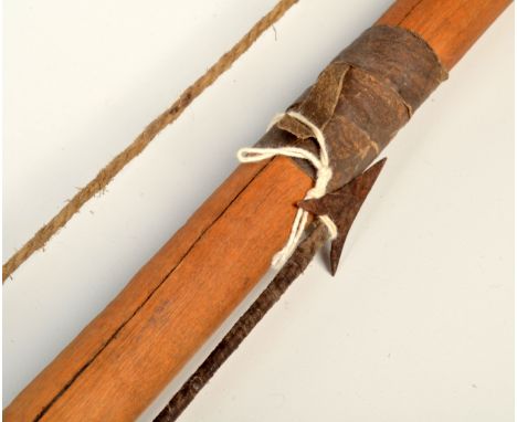 A Tanzania 'Hadza' tribe bow and arrow, length of bow 166cm. 