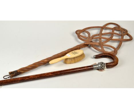 A cane carpet beater, a shooting stick and an ivory backed hair brush. 