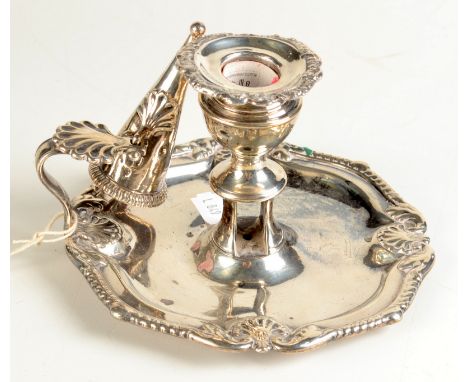 A George III silver chamber stick with gadrooned shell border and similar snuffer, marks rubbed, 11.5oz.