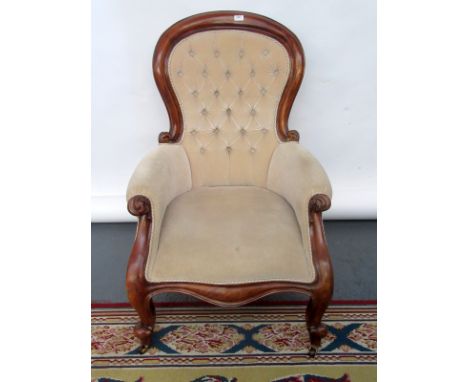 A Victorian mahogany button back salon chair.