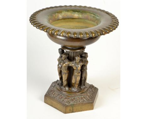 A Regency bronze urn on a column surrounded by a circle of six maidens, hexagonal base, height 22cm.