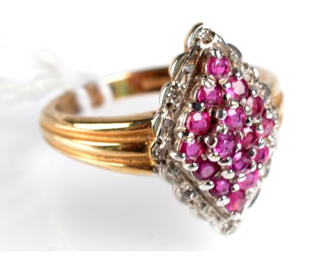 A 9ct. gold ring set a ruby and diamond lozenge cluster. 