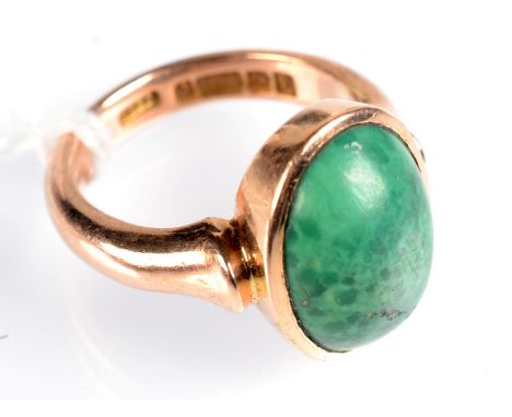 A 9ct. gold malachite ring. Condition Report: Size K. Stone is a little pitted and scratched.