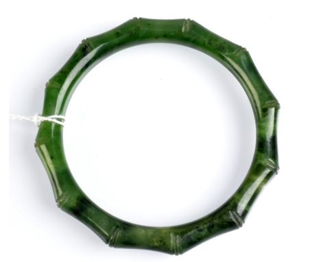 A Chinese jade bamboo carved bangle. Condition Report: 6cm inside diameter. Weight 34.2g.