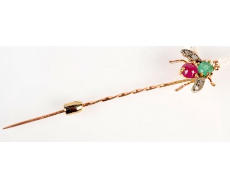 A 14ct. gold stick pin, the bee finial set with diamonds, an emerald and a ruby.  Condition Report: Length of bee, 1cm. Imper