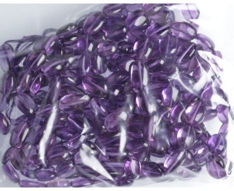 Three amethyst, oval shaped bead strands, each length 79cm.