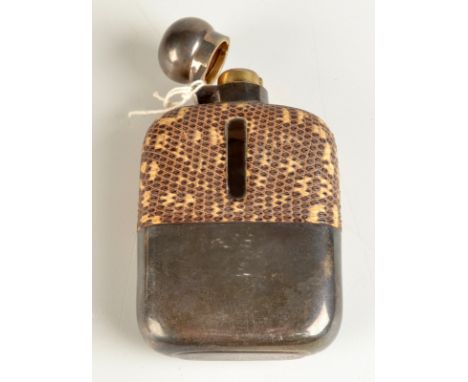 A spirit flask by James Dixon with bayonet silver lid and silver cup base, the shoulder covered with snake skin. Condition Re