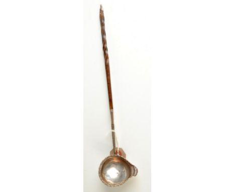 A George III punch ladle with spiral whale bone handle.