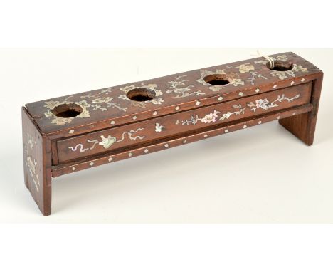 A 19th century Chinese hardwood and mother of pearl inlaid hat finial stand with four apertures above a drawer, width 28.8cm,