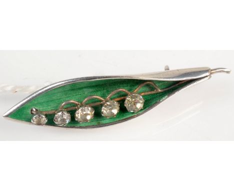 A lily of the valley silver and enamel brooch by Arthur Johnson Smith, Birmingham 1920.  Condition Report: no condition issue