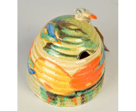 A Clarice Cliff Bizzare floral 'Delicia' pattern honey pot, the lid mounted with a bee, height 10cm. Condition Report: good c