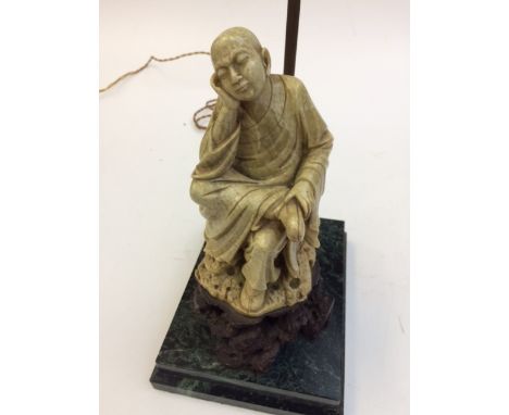 A fine Chinese soapstone figure of a seated sleeping monk on a marble plinth base, modelled as a table lamp. Condition Report