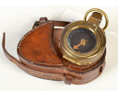A field prismatic compass ex-WD dated 1915 by Edward Koehn, Geneva, original leather case. 