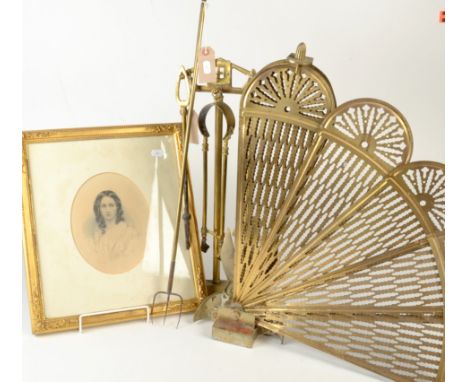 An Art Nouveau brass companion set, a brass fan fire screen, a toasting fork and a Victorian portrait print. 