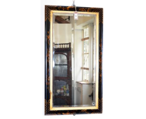 A Japanese black lacquered wall mirror, the frame with gilt decoration pagodas and floral sprays, 89 x 48cm.