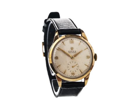 GENTLEMAN'S NINE CARAT GOLD ROLEX PRECISION MANUAL WIND WRIST WATCH, the round cream dial with applied Arabic and baton hour 