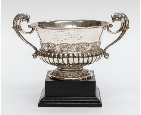 A Victorian silver two handled cup, the handles with lion's head terminals, with chased foliate mid section band above gadroo