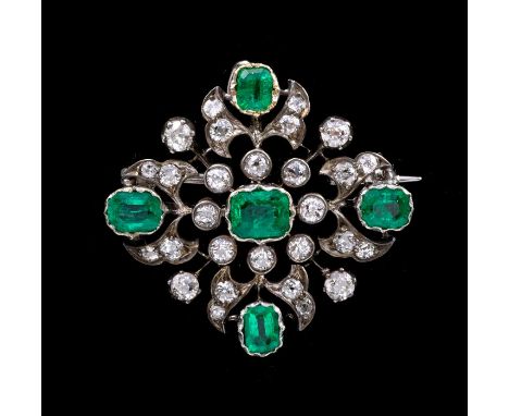 A diamond and emerald openwork lozenge shape Brooch/Pendant, comprising a rubover set central emerald-cut emerald, approximat