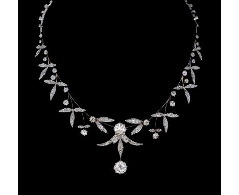 A diamond Necklace/Tiara comprising three detachable sections, mounted as one length on a base metal arched frame secured wit